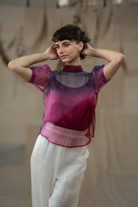 Woman wearing HeenaAgrima's Amethyst Silk Organza Top, a sheer, multicolored top with a blurred natural background