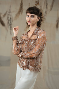 Woman wearing HeenaAgrima's Jaisalmer Jacket, a brown floral jacket against a neutral background