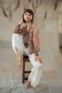 Woman wearing HeenaAgrima's Jaisalmer Jacket, a brown floral jacket against a neutral background