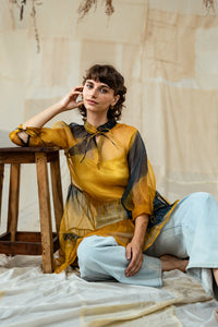 Woman wearing HeenaAgrima's Sunny Silk Organza Long Top, a yellow and blue layered outfit against a neutral background