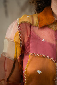 Woman wearing HeenaAgrima's Warm Indradhanush Silk Organza Shirt, a patchwork shirt with a neutral background