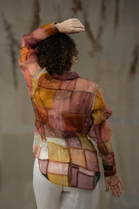Woman wearing HeenaAgrima's Warm Indradhanush Silk Organza Shirt, a patchwork shirt with a neutral background