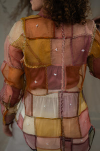 back of the Woman wearing HeenaAgrima's Warm Indradhanush Silk Organza Shirt, a patchwork shirt with a neutral background