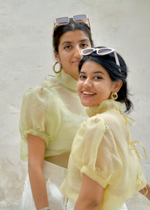 Two women wearing light yellow tops with puffed sleeves against a white background, OG Fallon Organza Shirt - HeenaAgrima