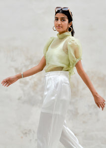 Woman wearing a light green organza shirt with puffed sleeves and white pants against a light background - OG Fallon Organza Shirt by HeenaAgrima