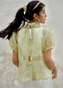 Woman wearing a light green Organza Shirt with sheer sleeves against a neutral background - OG Fallon Organza Shirt by HeenaAgrima
