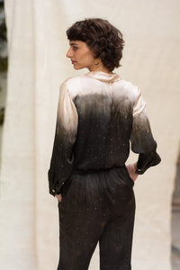 Woman wearing HenaAgrima's Papilio Satin Silk Shirt, a black and gray gradient outfit against a neutral background