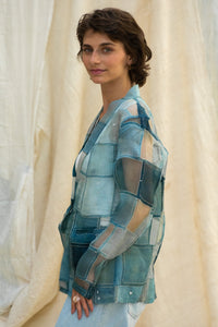 Woman wearing HeenaAgrima's Blu Dream Jacket, a blue patchwork organza jacket against a neutral background