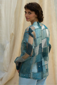 Woman wearing HeenaAgrima's Blu Dream Jacket, a blue patchwork organza jacket against a neutral background. 
