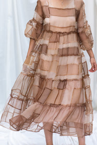 HeenaAgrima's Mocha Dress, a Sheer, tiered dress with a brown and beige color scheme on a white background