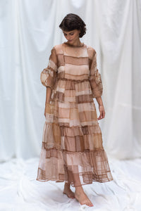 HeenaAgrima's Mocha Dress, a Sheer, tiered dress with a brown and beige color scheme on a white background