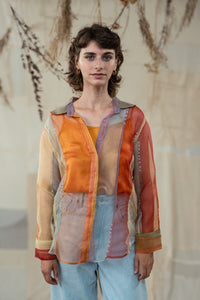Woman wearing HeenaAgrima's Verti 2.0 Silk Organza Shirt, a colorful, patterned shirt with a neutral background
