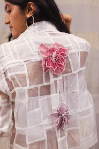 Woman wearing heenaAgrima Snow Blossom Organza Shirt, a white sheer shirt with floral embroidery against a neutral background