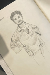 Sketch of a person on a piece of paper