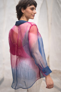 Woman wearing HeenaAgrima's Oasis 2.0 Silk Organza Shirt, a colorful, sheer shirt, naturally dyed sappanwood and indigo.