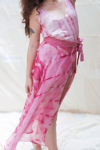 Person wearing HeenaAgrima's Gulabi Silk Organza Skirt, a pink tie-dye dress with a white background