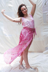 Woman wearing HeenaAgrima's Gulabi Silk Organza Skirt, a pink tie-dye dress against a white background.