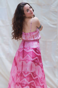 Woman wearing HeenaAgrima's Gulabi Silk Organza Skirt, a pink tie-dye dress against a white background.